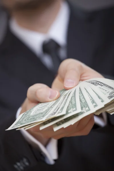 Hands holding american dollars — Stock Photo, Image