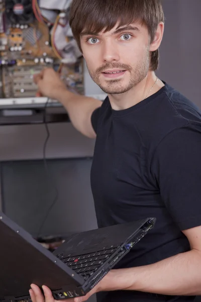 Technician fixing problem on computer — Stock Photo, Image