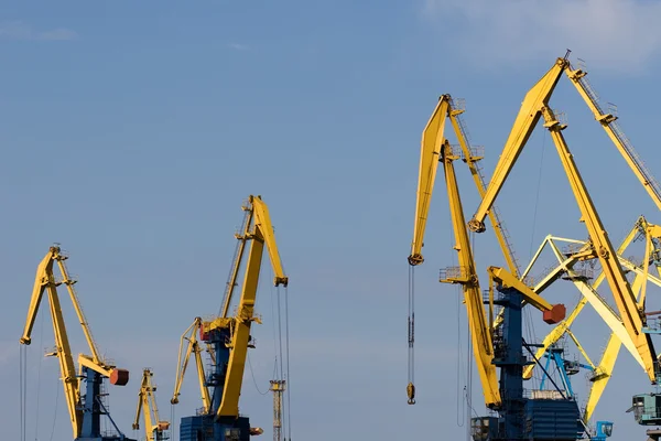 Four big industrial level luffing cranes — Stock Photo, Image
