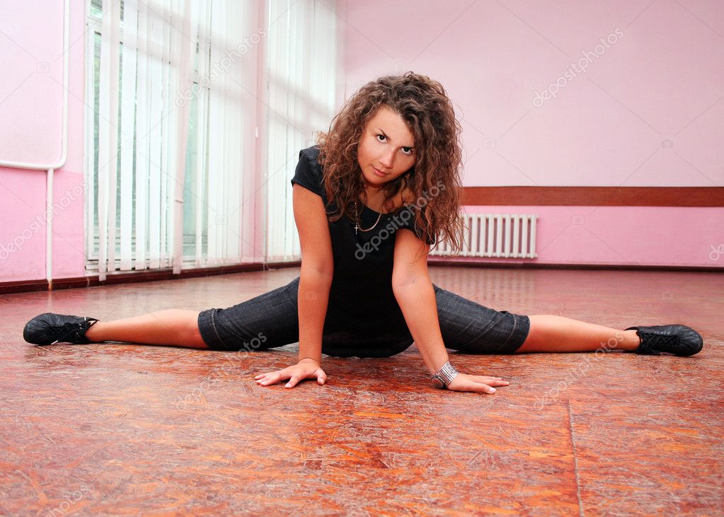 Young teenage girl stretching