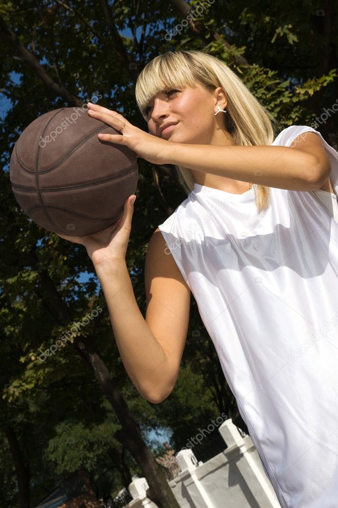 Girl playing basketball outside