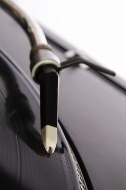 Closeup shot of vinyl playing turntable clipart