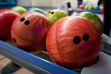 Bowling balls on a shelf clipart