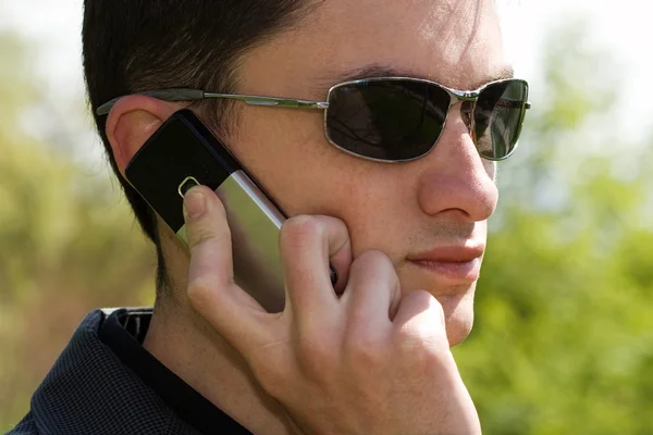 stock image Young businessman with mobile phone