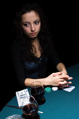 Beautiful girl playing poker clipart