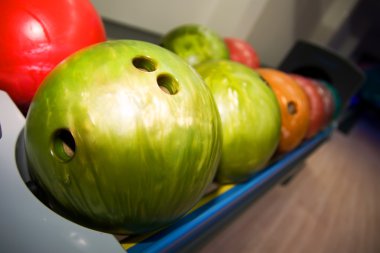 Shelf with bowling balls clipart