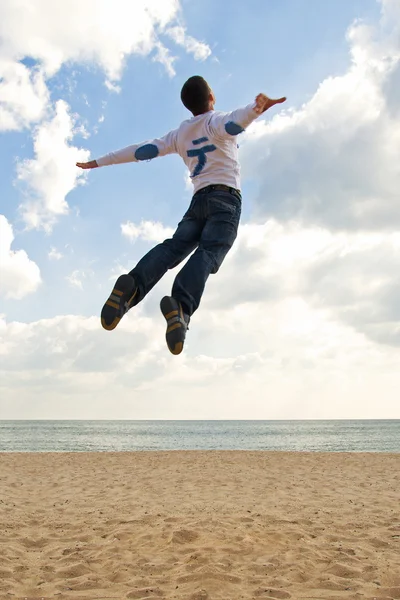 Boy jumping into the sky — Stock Photo, Image