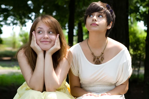 Beautiful girls posing in the park — Stock Photo, Image