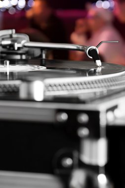 Turntable playing vinyl audio record clipart