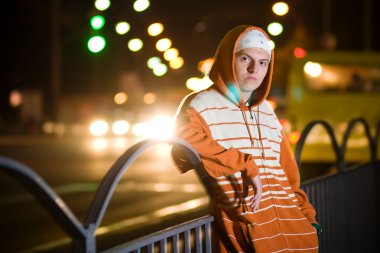 Teenage gang member at night clipart