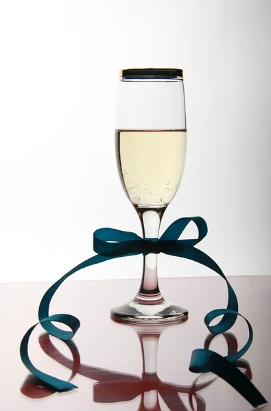 Goblet champaign with blue ribbon — Stock Photo, Image