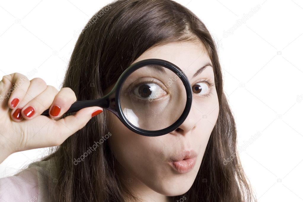 Girl looking through the magnifying glas