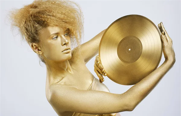 Goldenes Mädchen mit Vinyl — Stockfoto