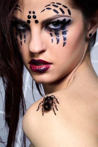 Spider-girl with spider Brachypelma smithi