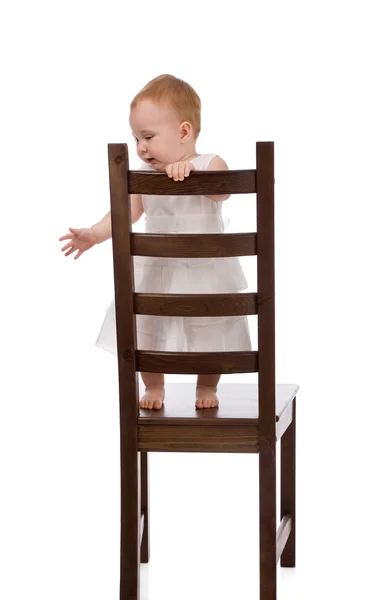 Dziecko z krzesłem — Zdjęcie stockowe