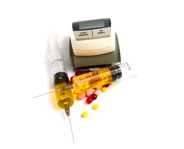 Tonometer, tablets, syringes — Stock Photo, Image