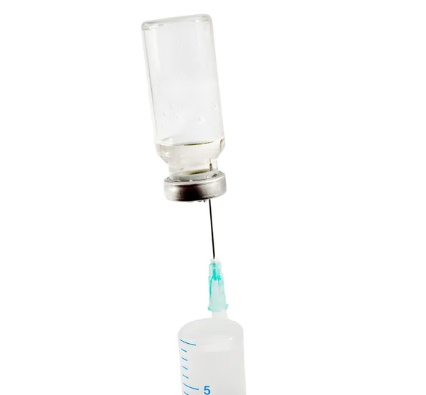 Ležela injekční stříkačka s očkovací látkou — Stock fotografie