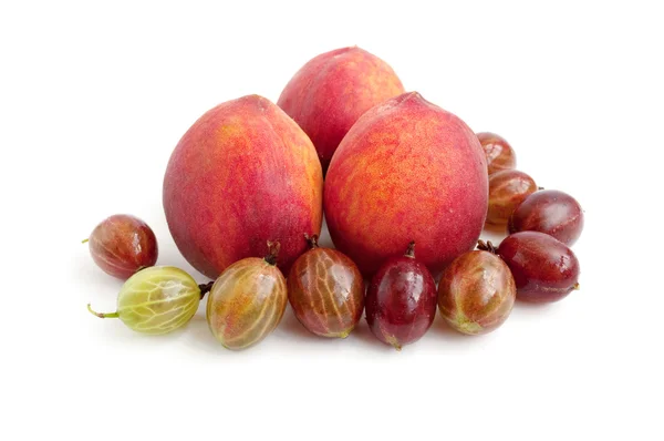 Ripe, juicy peach and gooseberry — Stock Photo, Image