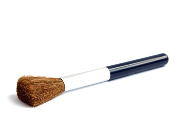 Escova para maquiagem em fundo branco — Fotografia de Stock