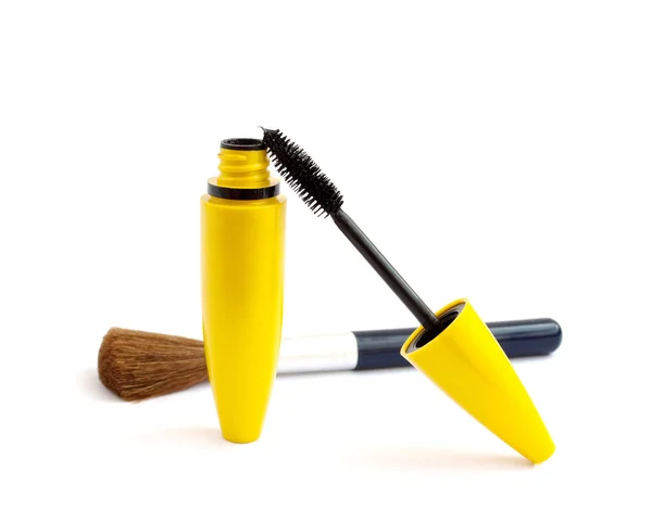 Black mascara and a brush for makeup — Stock Photo, Image