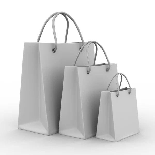 Trzy zakupy torby na biały — Zdjęcie stockowe