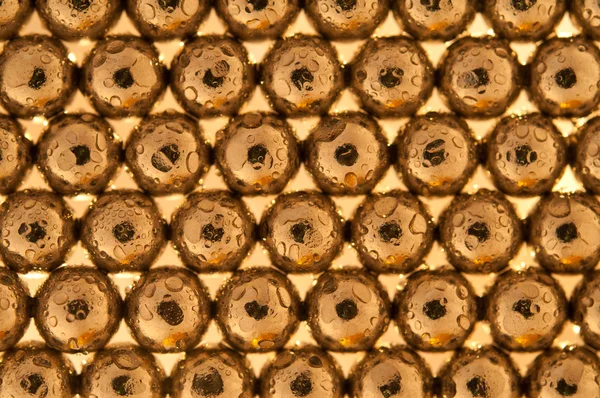 Shiny gold beads background — Stock Photo, Image