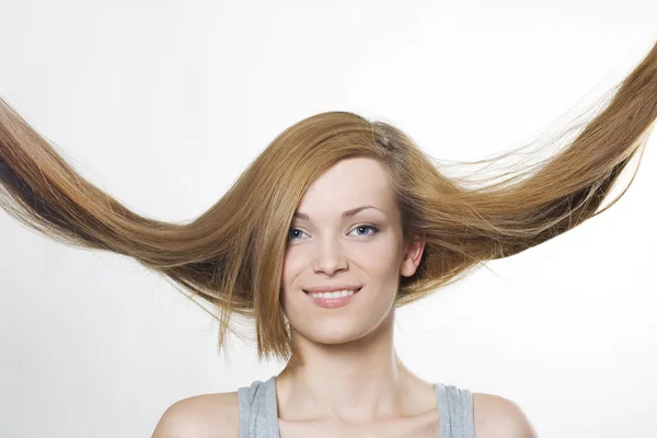 Mulher bonita com cabelo voando — Fotografia de Stock