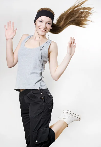 Mujer feliz bailando con el jugador —  Fotos de Stock