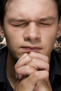 Young man praying clipart