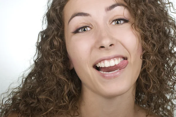 Woman sticking her tongue out — Stock Photo, Image