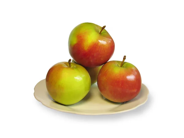 Четыре яблока на тарелке — стоковое фото