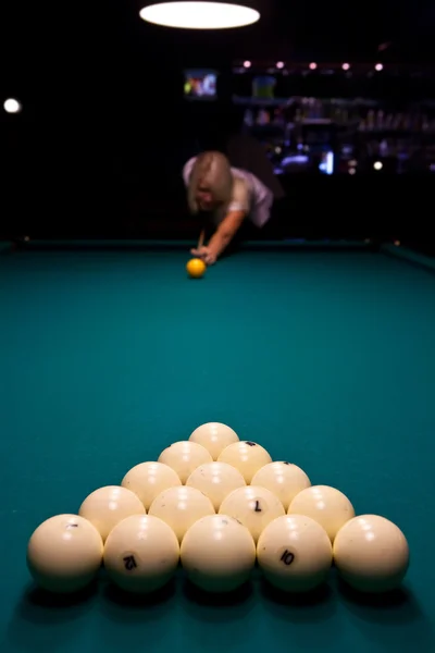 Pretty girl is playing pool — Stock Photo, Image