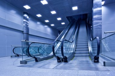 Two escalators in trade center clipart