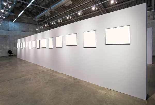 Grey wall with many frames — Stock Photo, Image