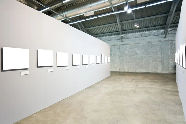 Grey walls with many frames — Stock Photo, Image