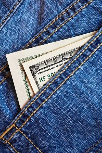 Jeans zak met dollars bankbiljetten — Stockfoto