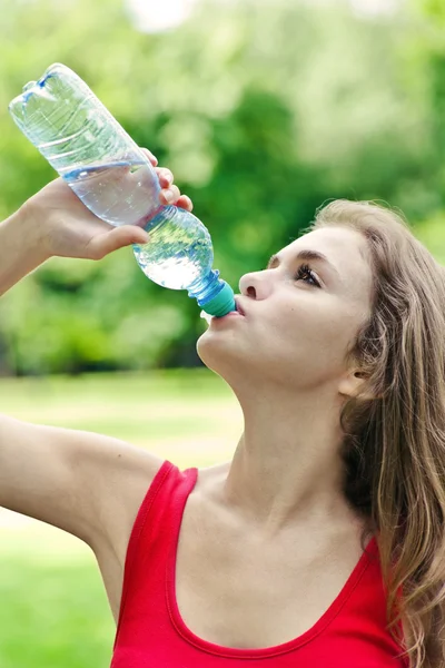 stock image Girl drink water in park