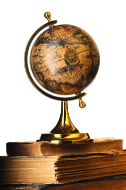 Antique globe on books clipart