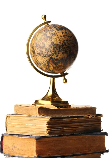 stock image Antique globe on books