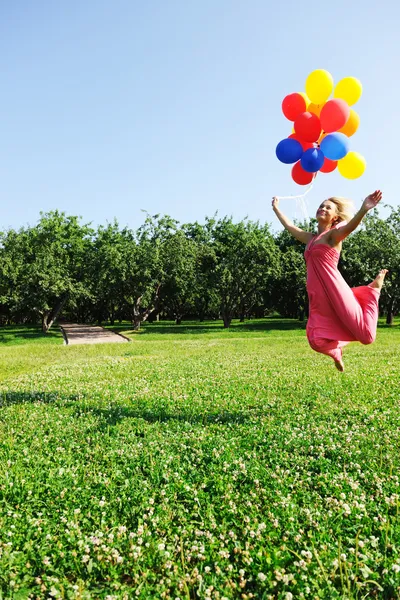 Flying with balloons — Stock Photo, Image