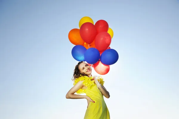 Женщина с воздушными шарами — стоковое фото