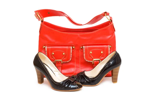 stock image Red bag and black shoes isolated