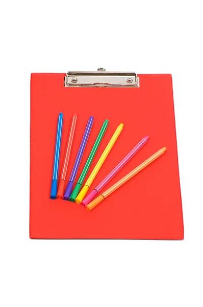 Almohadilla roja y lápices de colores aislados — Foto de Stock