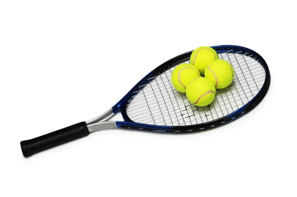 Теннисные ракетки и четыре изолированных мяча — стоковое фото