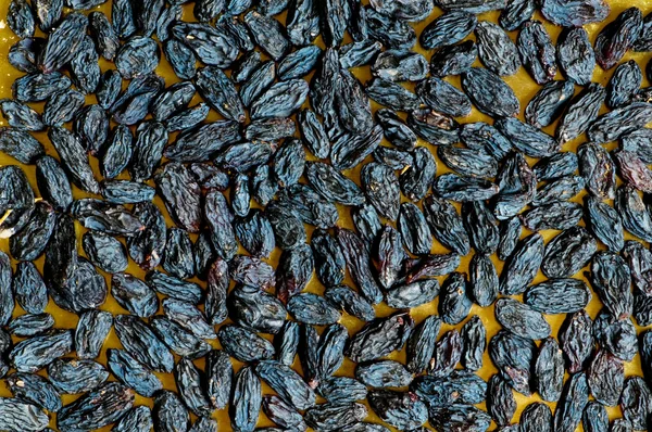 Background made of dark raisins — Stock Photo, Image