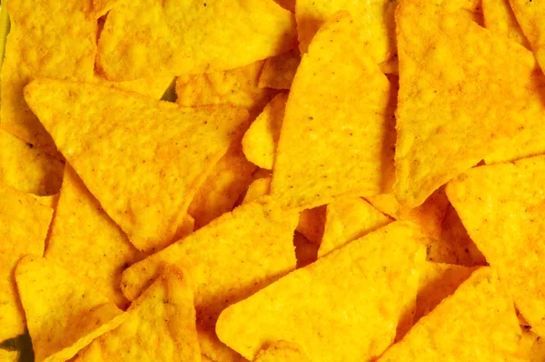 Heap of chips arranged on background — Stock Photo, Image