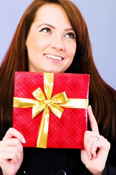 Young woman with red gift box — Stock Photo, Image