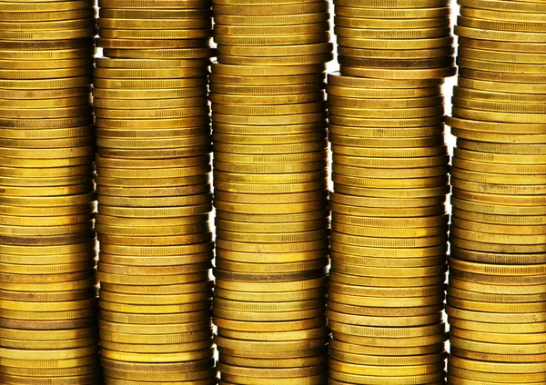 Primo piano delle pile di monete d'oro — Foto Stock