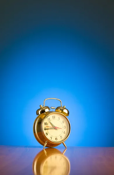 Alarm clock against background — Stock Photo, Image