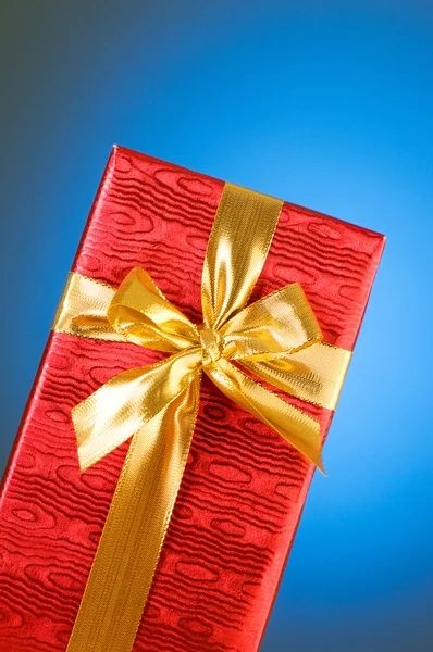 Gift box against gradient — Stock Photo, Image
